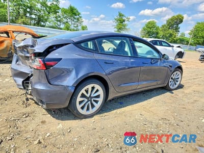 Trzecie zdjęcie samochodu z tyłu: 2023 TESLA MODEL 3 VIN:5YJ3E1EA3PF658283 - miniatura