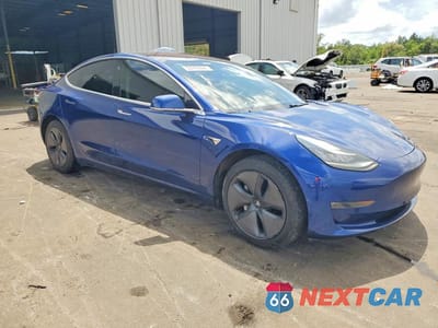 Czwarte zdjęcie samochodu z boku: 2018 TESLA MODEL 3 VIN:5YJ3E1EA0JF005580 - miniatura