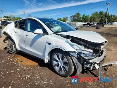 Czwarte zdjęcie samochodu z boku: 2022 TESLA MODEL Y VIN:7SAYGDEE7NF364440 - miniatura