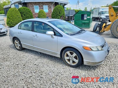 Czwarte zdjęcie samochodu z boku: 2006 HONDA CIVIC EX VIN:2HGFA16866H501829 - miniatura