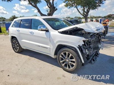 Czwarte zdjęcie samochodu z boku: 2018 JEEP GRAND CHEROKEE OVERLAND VIN:1C4RJECG1JC204994 - miniatura