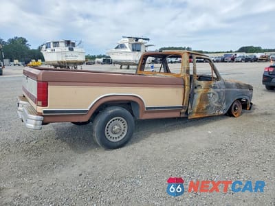Trzecie zdjęcie samochodu z tyłu: 1986 FORD F150 VIN:1FTCF15H0GNB10513 - miniatura