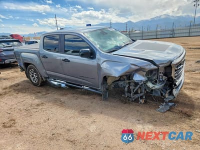Czwarte zdjęcie samochodu z boku: 2021 GMC CANYON AT4 VIN:1GTG6FENXM1116164 - miniatura