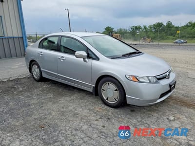Czwarte zdjęcie samochodu z boku: 2007 HONDA CIVIC HYBRID VIN:JHMFA362X7S023736 - miniatura