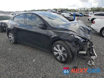 Czwarte zdjęcie samochodu z boku: 2023 TESLA MODEL Y VIN:7SAYGAEE5PF858586 - miniatura