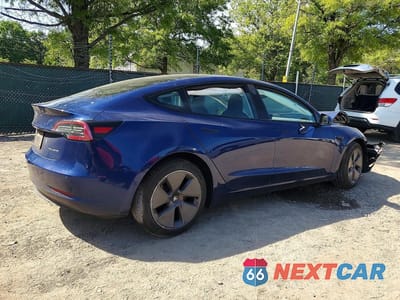 Trzecie zdjęcie samochodu z tyłu: 2022 TESLA MODEL 3 VIN:5YJ3E1EBXNF179574 - miniatura