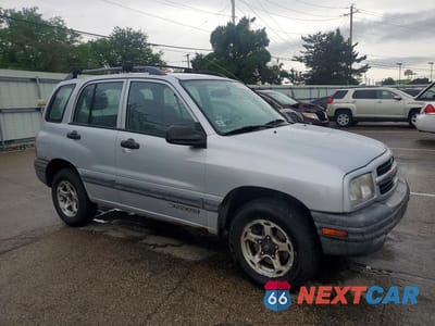Czwarte zdjęcie samochodu z boku: 1999 CHEVROLET TRACKER VIN:2CNBJ13C8X6917086 - miniatura