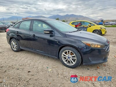 Czwarte zdjęcie samochodu z boku: 2016 FORD FOCUS SE VIN:1FADP3F2XGL286459 - miniatura