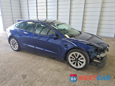 Czwarte zdjęcie samochodu z boku: 2022 TESLA MODEL 3 VIN:5YJ3E1EA3NF368929 - miniatura