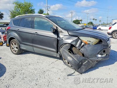Czwarte zdjęcie samochodu z boku: 2015 FORD ESCAPE TITANIUM VIN:1FMCU9J92FUA21416 - miniatura
