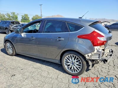 Drugie zdjęcie samochodu z przodu: 2014 FORD FOCUS TITANIUM VIN:1FADP3N21EL311957 - miniatura