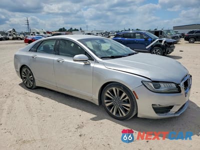 Czwarte zdjęcie samochodu z boku: 2017 LINCOLN MKZ SELECT VIN:3LN6L5C90HR604924 - miniatura