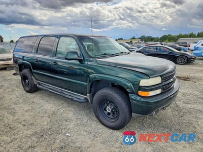 Czwarte zdjęcie samochodu z boku: 2001 CHEVROLET SUBURBAN K1500 VIN:3GNFK16T91G272191 - miniatura