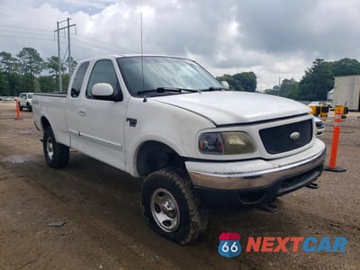 Czwarte zdjęcie samochodu z boku: 1999 FORD F150 VIN:1FTRX18L3XNA64179 - miniatura