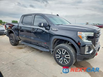 Czwarte zdjęcie samochodu z boku: 2021 GMC SIERRA K1500 AT4 VIN:3GTP9EED3MG284349 - miniatura
