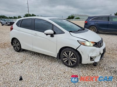 Czwarte zdjęcie samochodu z boku: 2016 HONDA FIT EX VIN:JHMGK5H70GX041512 - miniatura