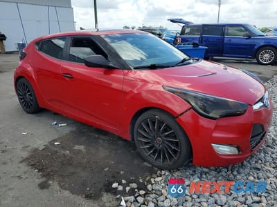 Czwarte zdjęcie samochodu z boku: 2013 HYUNDAI VELOSTER BASE VIN:KMHTC6AD6DU122297 - miniatura