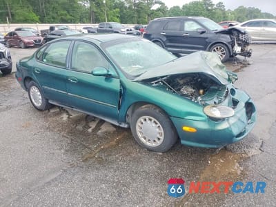 Czwarte zdjęcie samochodu z boku: 1999 FORD TAURUS SE VIN:1FAFP53U5XA102356 - miniatura