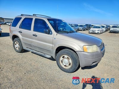 Czwarte zdjęcie samochodu z boku: 2001 FORD ESCAPE XLS VIN:1FMYU02171KA68598 - miniatura
