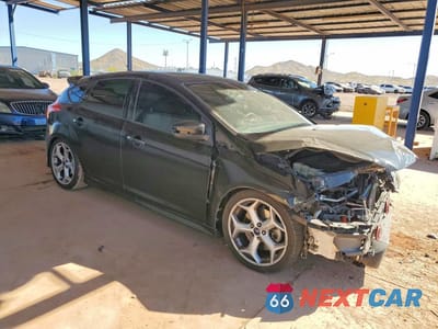 Czwarte zdjęcie samochodu z boku: 2013 FORD FOCUS ST VIN:1FADP3L99DL127087 - miniatura