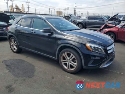 Czwarte zdjęcie samochodu z boku: 2015 MERCEDES-BENZ GLA 250 4MATIC VIN:WDCTG4GBXFJ086650 - miniatura