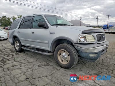 Czwarte zdjęcie samochodu z boku: 1999 FORD EXPEDITION VIN:1FMPU18L7XLB85062 - miniatura
