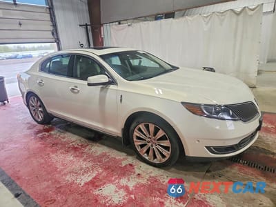Czwarte zdjęcie samochodu z boku: 2013 LINCOLN MKS VIN:1LNHL9FTXDG616412 - miniatura