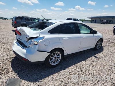 Trzecie zdjęcie samochodu z tyłu: 2016 FORD FOCUS SE VIN:1FADP3F22GL352339 - miniatura