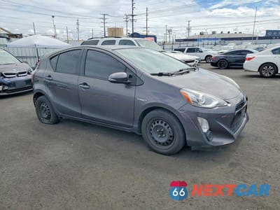Czwarte zdjęcie samochodu z boku: 2015 TOYOTA PRIUS C TWO VIN:JTDKDTB3XF1575960 - miniatura