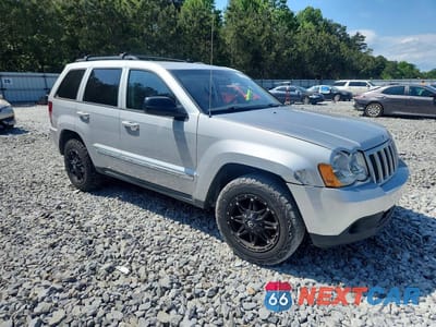 Czwarte zdjęcie samochodu z boku: 2010 JEEP GRAND CHEROKEE LAREDO VIN:1J4PS4GK4AC131465 - miniatura