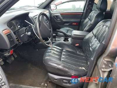 Zdjęcie 7 z 13 samochodu: 1999 JEEP GRAND CHEROKEE LIMITED VIN:1J4GW68N1XC671972 - miniatura