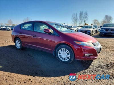 Czwarte zdjęcie samochodu z boku: 2010 HONDA INSIGHT LX VIN:JHMZE2H54AS801457 - miniatura