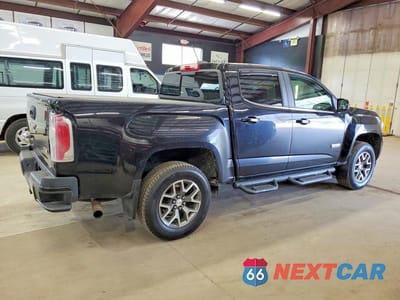 Trzecie zdjęcie samochodu z tyłu: 2016 GMC CANYON SLE VIN:1GTP6CE12G1234645 - miniatura