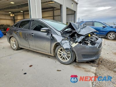 Czwarte zdjęcie samochodu z boku: 2016 FORD FOCUS VIN:1FADP3F27GL391556 - miniatura