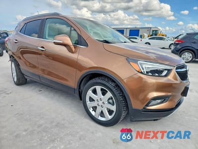 Czwarte zdjęcie samochodu z boku: 2017 BUICK ENCORE ESSENCE VIN:KL4CJCSM1HB125417 - miniatura