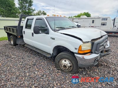 Czwarte zdjęcie samochodu z boku: 1999 FORD F350 SUPER DUTY VIN:1FTWW33F3XEB25629 - miniatura