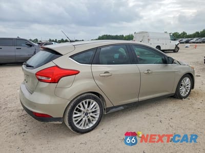 Trzecie zdjęcie samochodu z tyłu: 2015 FORD FOCUS TITANIUM VIN:1FADP3N21FL268836 - miniatura