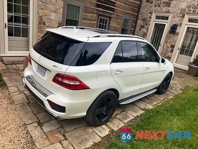 Czwarte zdjęcie samochodu z boku: 2015 MERCEDES-BENZ ML 63 AMG VIN:4JGDA7EB0FA474921 - miniatura