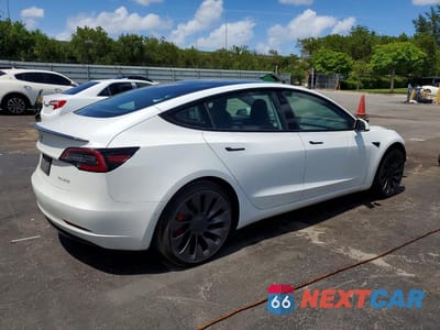 Trzecie zdjęcie samochodu z tyłu: 2021 TESLA MODEL 3 VIN:5YJ3E1EC2MF026565 - miniatura