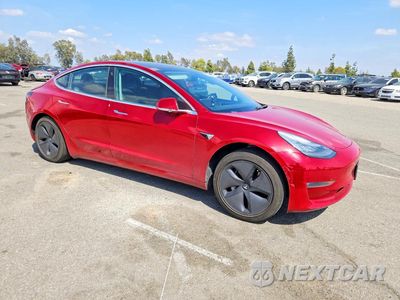 Czwarte zdjęcie samochodu z boku: 2018 TESLA MODEL 3 VIN:5YJ3E1EB3JF114785 - miniatura
