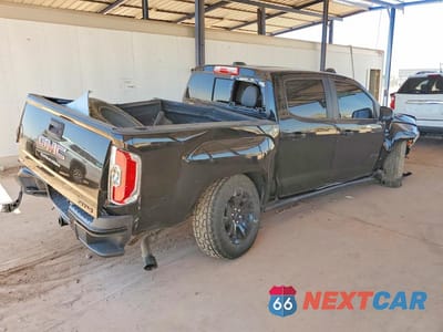 Trzecie zdjęcie samochodu z tyłu: 2021 GMC CANYON AT4 VIN:1GTG6FEN9M1279680 - miniatura