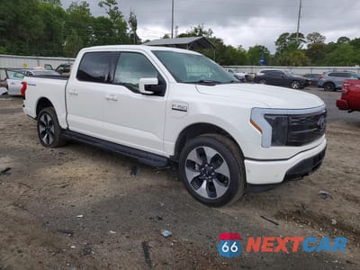 Czwarte zdjęcie samochodu z boku: 2023 FORD F150 LIGHTNING PRO VIN:1FT6W1EV2PWG01047 - miniatura