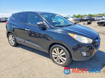 Czwarte zdjęcie samochodu z boku: 2011 HYUNDAI TUCSON LIMITED VIN:KM8JUCACXBU282898 - miniatura