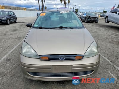 Piąte zdjęcie samochodu w środku: 2003 FORD FOCUS LX VIN:1FAFP33Z63W329438 - miniatura