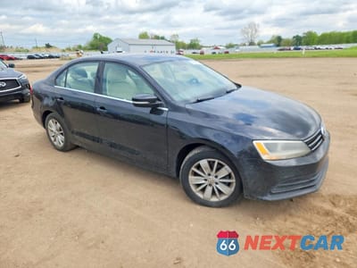 Czwarte zdjęcie samochodu z boku: 2015 VOLKSWAGEN JETTA SE VIN:3VWD07AJ6FM347367 - miniatura