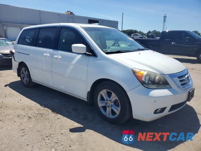 Czwarte zdjęcie samochodu z boku: 2010 HONDA ODYSSEY TOURING VIN:5FNRL3H96AB047345 - miniatura