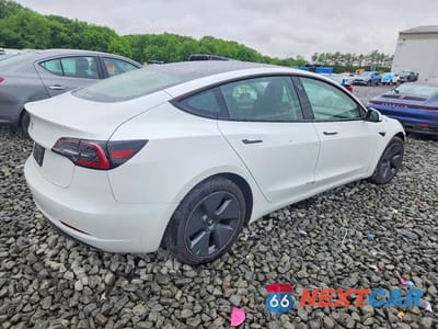 Trzecie zdjęcie samochodu z tyłu: 2023 TESLA MODEL 3 VIN:5YJ3E1EA9PF574596 - miniatura