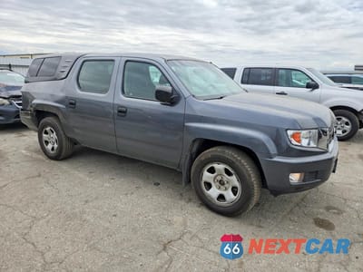 Czwarte zdjęcie samochodu z boku: 2010 HONDA RIDGELINE RT VIN:5FPYK1F2XAB010802 - miniatura