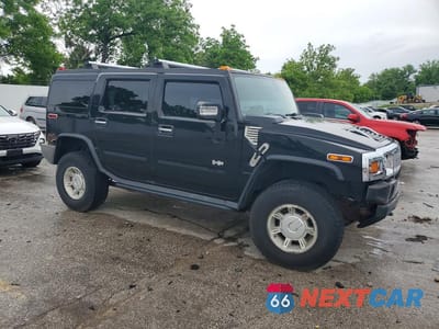 Czwarte zdjęcie samochodu z boku: 2004 HUMMER H2 VIN:5GRGN23U24H112847 - miniatura