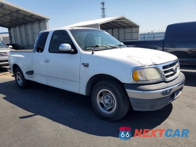 Czwarte zdjęcie samochodu z boku: 2001 FORD F150 VIN:1FTRX07L71KF68268 - miniatura